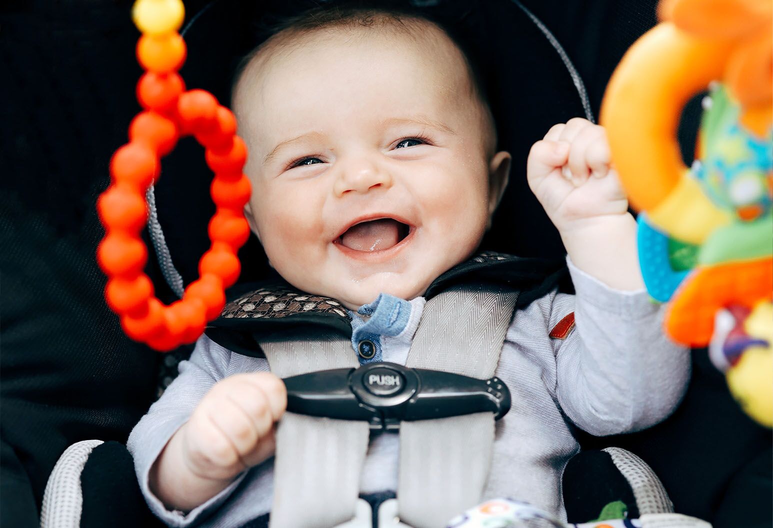 a baby smiling and laughing
