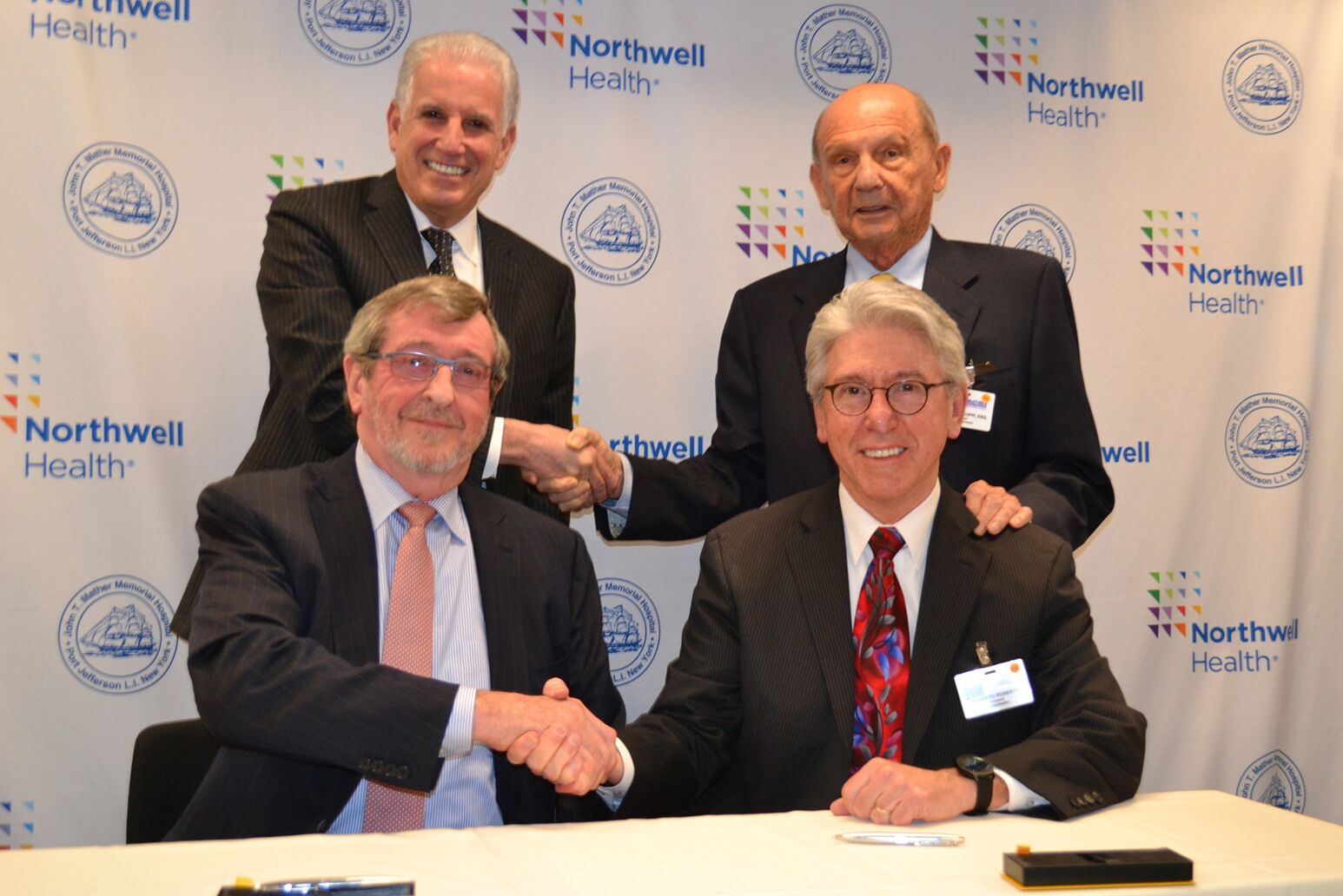 Michael Dowling, Mark Claster with Mather Hospital leadership as the hospital officially became a member of Northwell Health