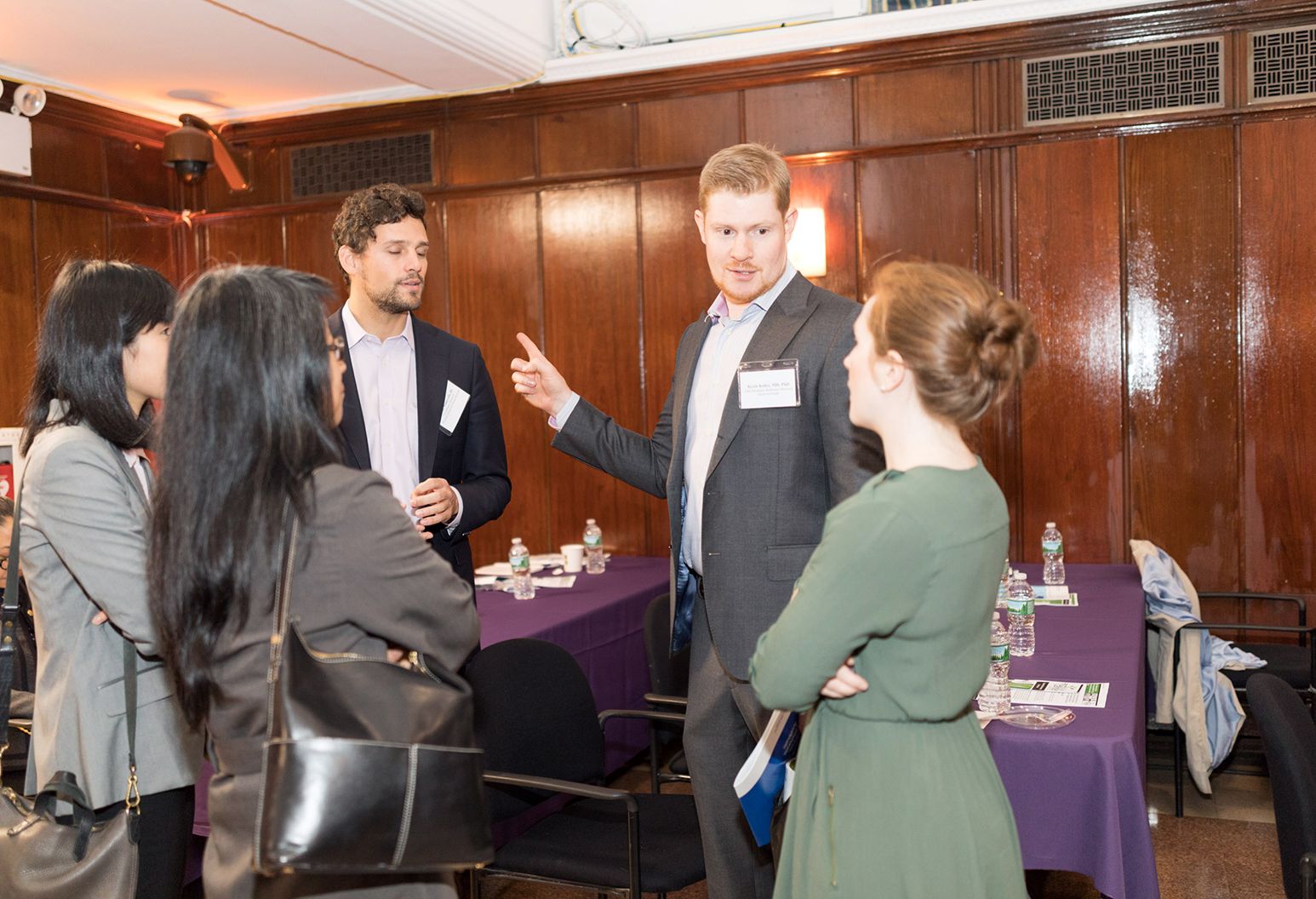 Group of young professionals talking in meeting room