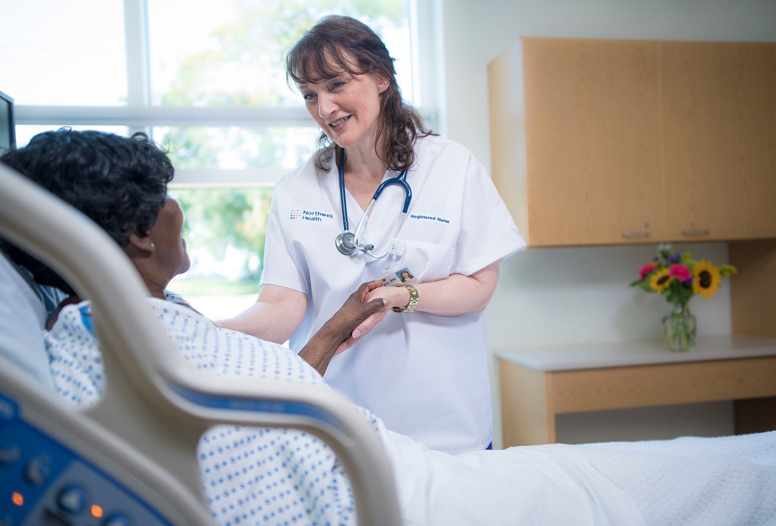 Northwell Health Registered Nursing helping patient