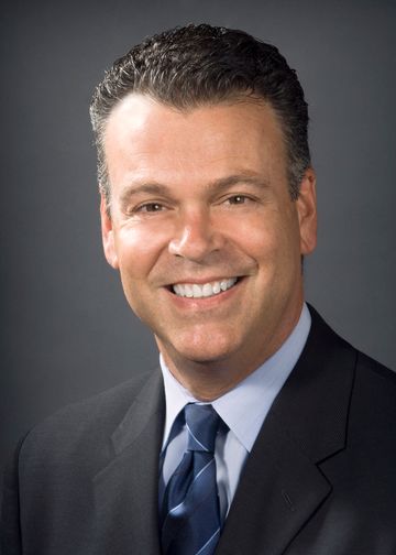 David Battinelli, MD, wearing a blue shirt and blue tie