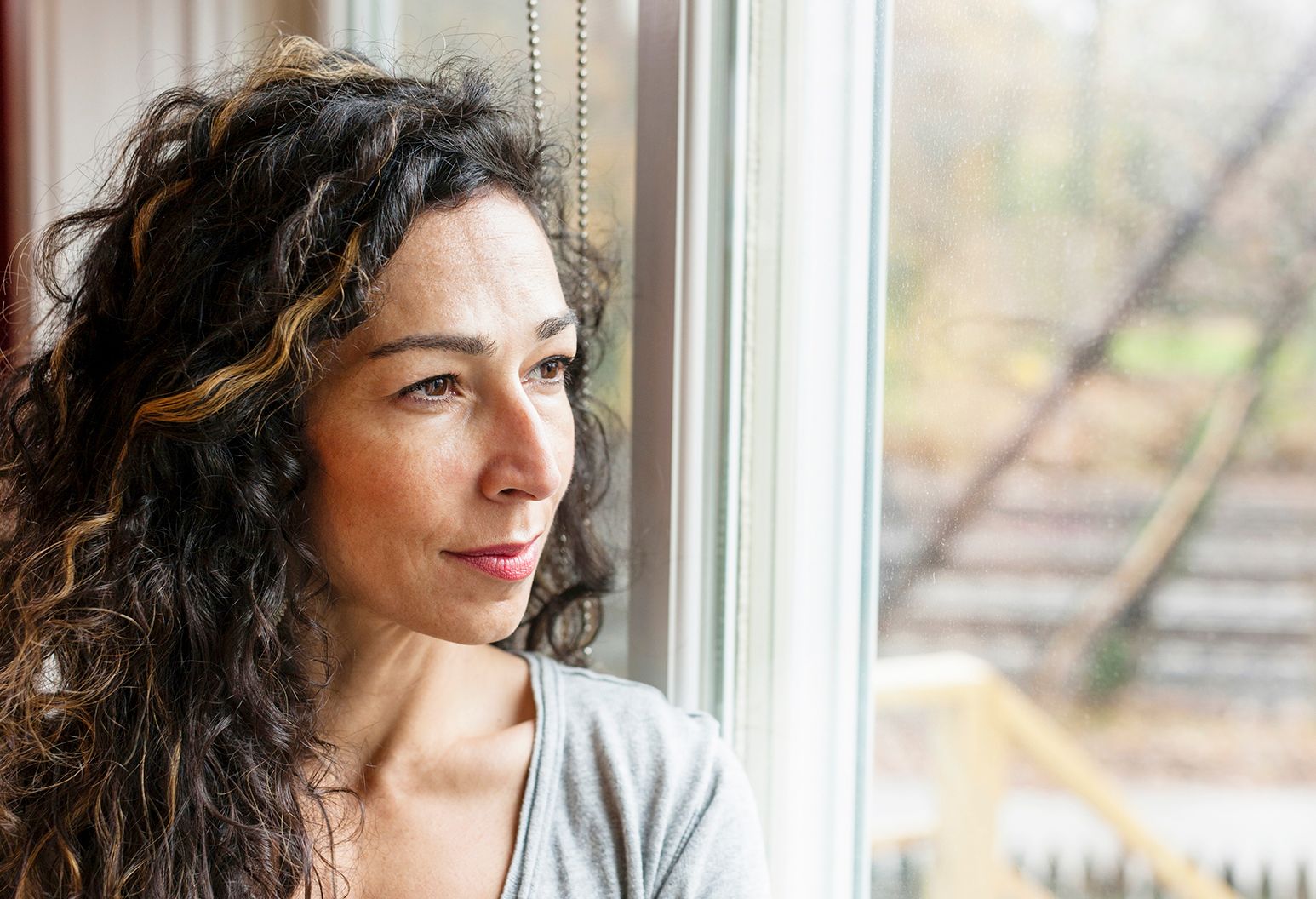 Woman looking out a window
