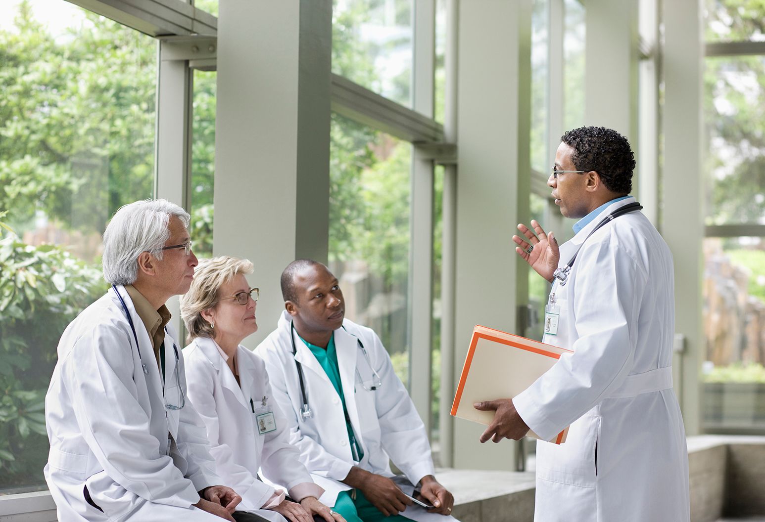 Doctors talking together in lobby