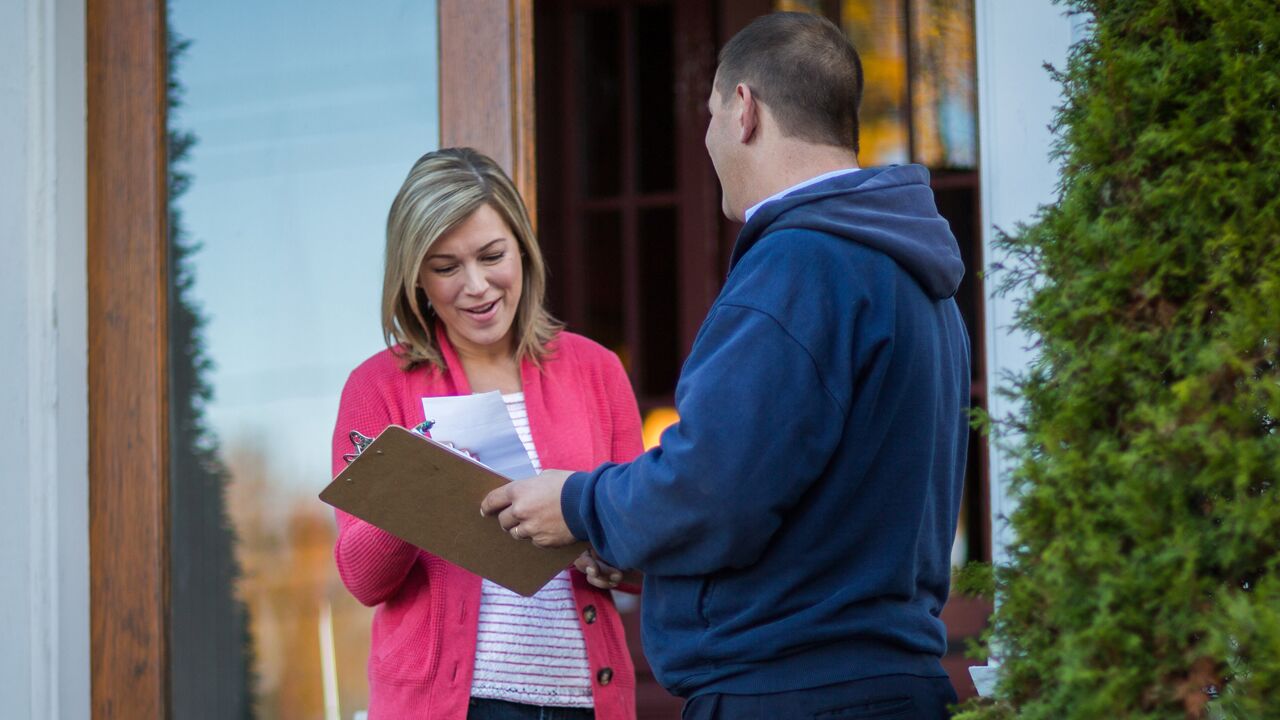 alt="happy woman reading fuel delivery paperwork" alt="happy woman reading fuel delivery paperwork"