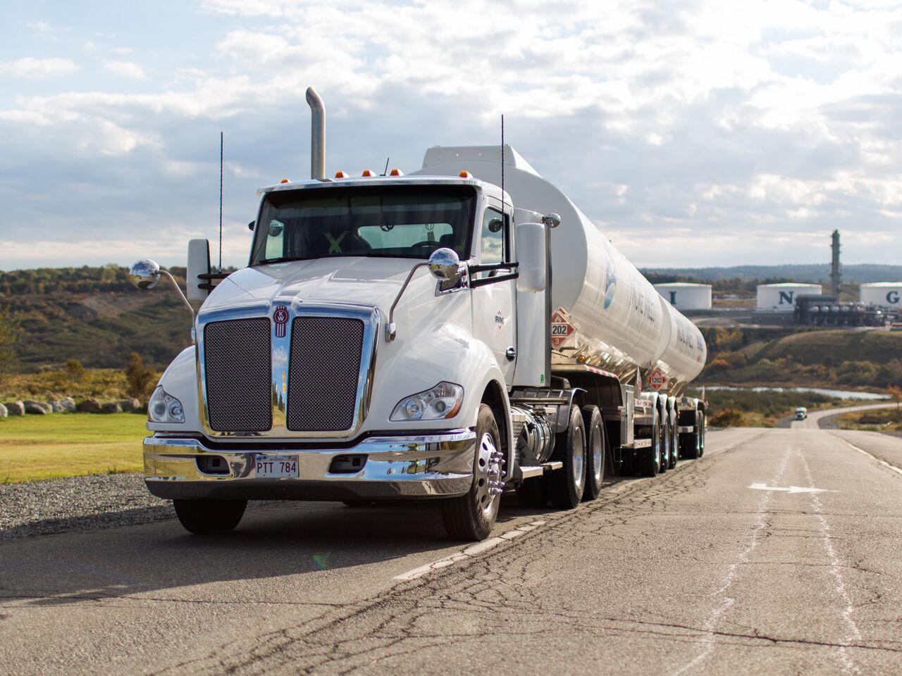alt="fuel transport truck leaving refinery" alt="fuel transport truck leaving refinery"