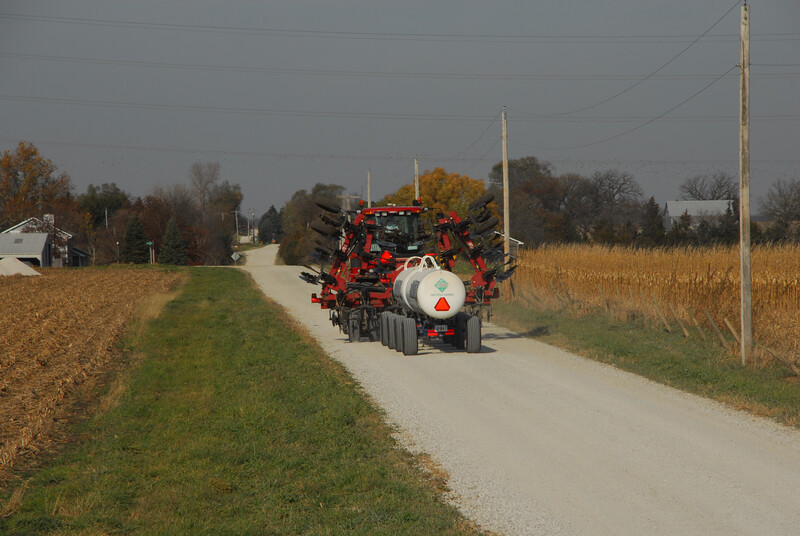 Farm equipment on a rural road during harvest. Farm equipment on rural road 08