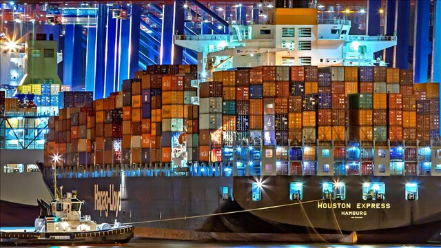 Container ship pulling into port. (640 x 360) Container ship
