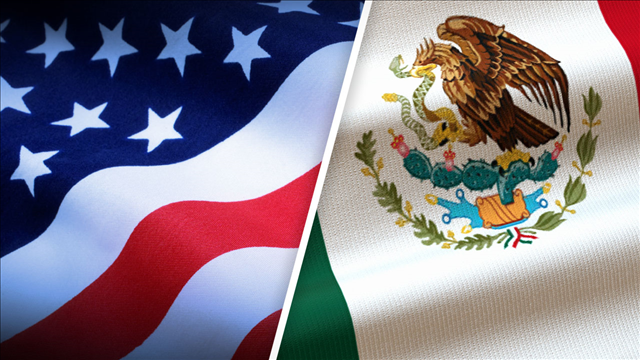 Flags of US and Mexico represent trade relations between the two nations US - Mexico