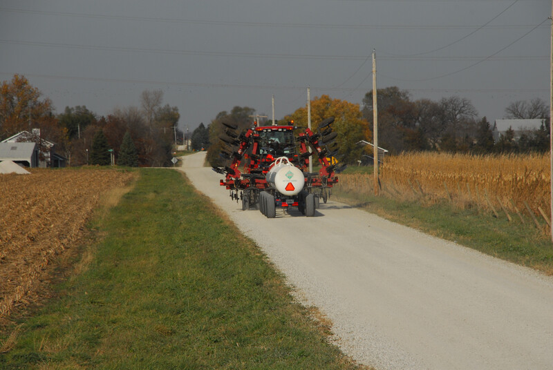 Farm equipment on a rural road during harvest. Farm equipment on rural road 10