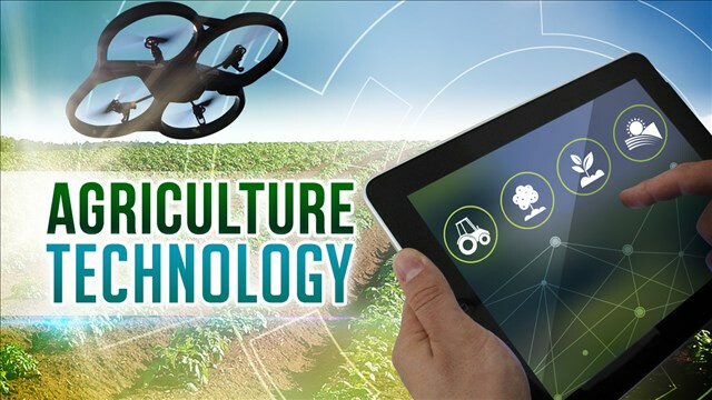 Farmer holding I-pad, or similar device, operating a UAV, or drone, includes title of Agriculture Technology Drone technology on farm